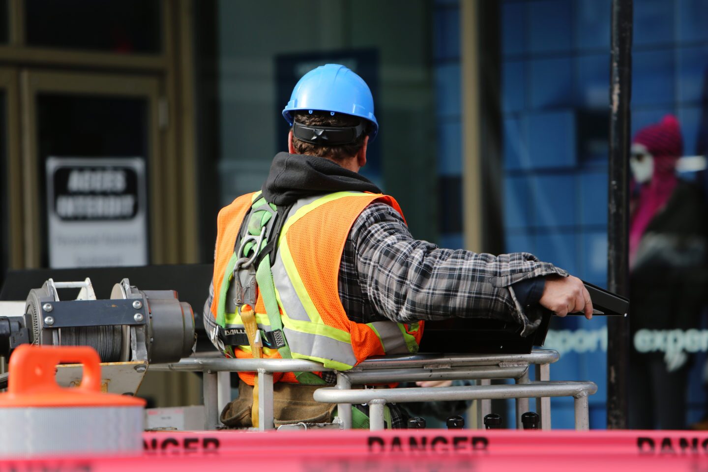 Construction worker with safety vest and hard hat