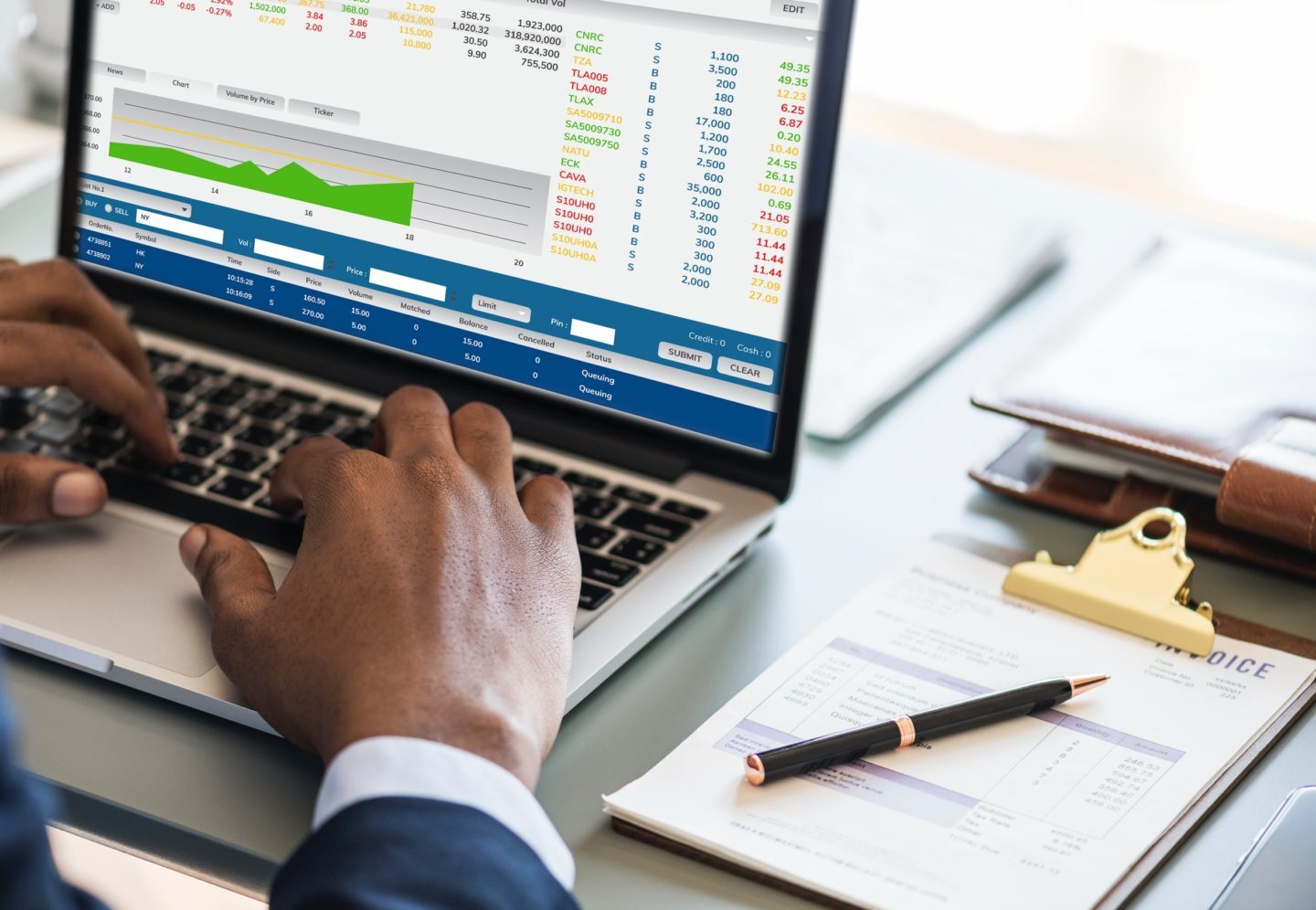 man using construction accounting software on a laptop