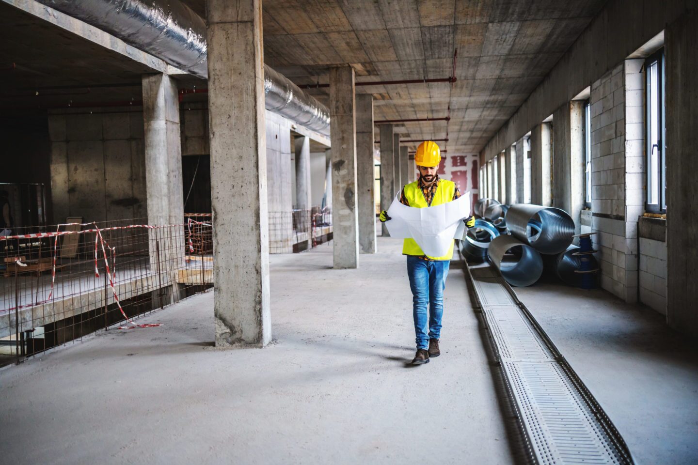 Contract Financing Image: Contractor Walking Through Construction Site