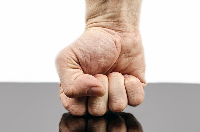 Fist punching a table