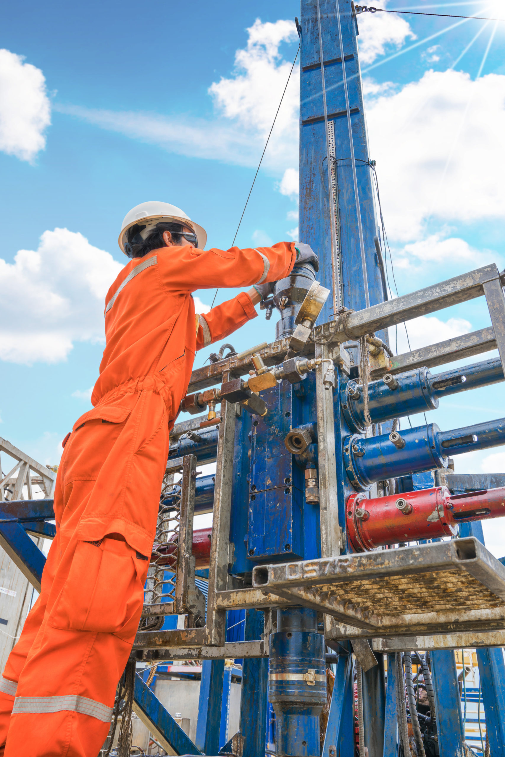 Offshore oil rig worker prepare tool and equipment for perforation gases well at wellhead remote platform, Oil and gas production and exploration industry job in Thailand.